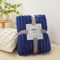 Navy blue ribbed fleece throw blanket, folded with tag